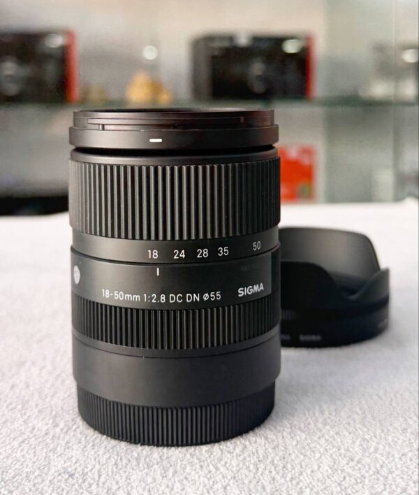 photo_2025-12-14_04-01-13 Sigma 18-50mm f/2.8 DC DN Contemporary Lens for Sony E-Mount with Accessory Bundle