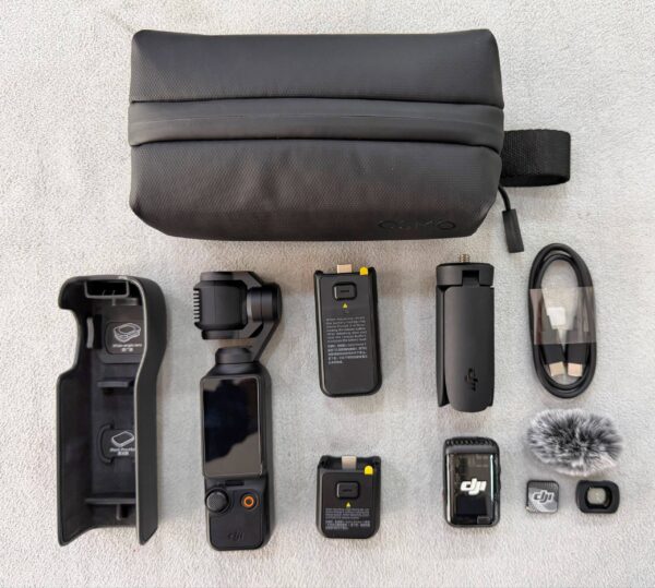 DJI Osmo Pocket 3 Creator Combo like new with 1-inch CMOS sensor, DJI Mic 2, wide lens, battery handle, and mini tripod