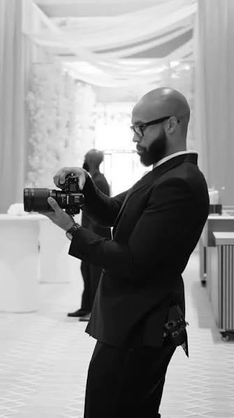 Best lens for wedding photography being used by professional at Camerion Cameras
